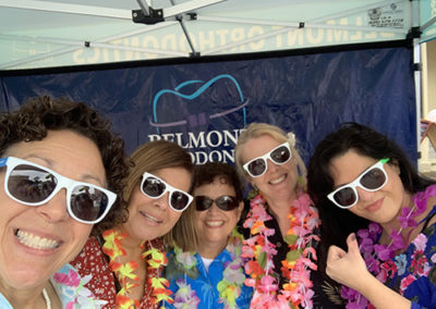 Group of People with standing with Dr. Melita wearing sunglasses