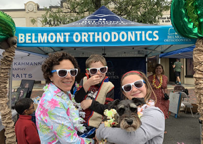 Dr. Melita standing with patients wearing sunglasses